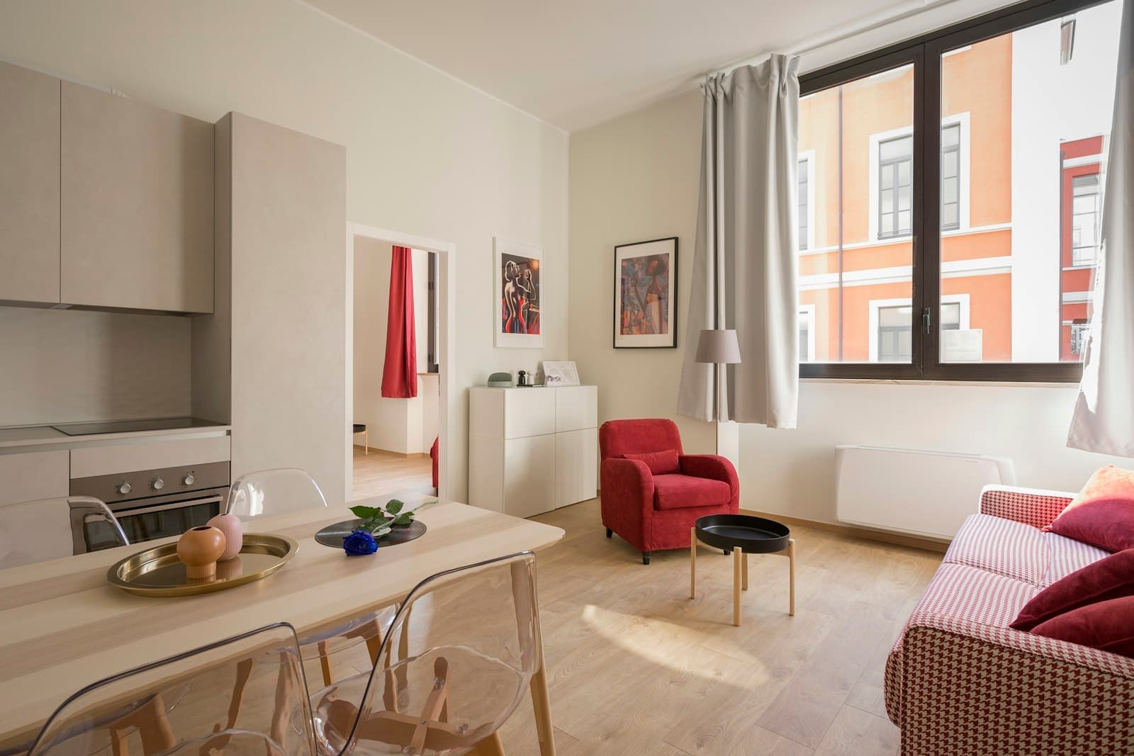 Open living and dining space, with the north-facing balcony beyond